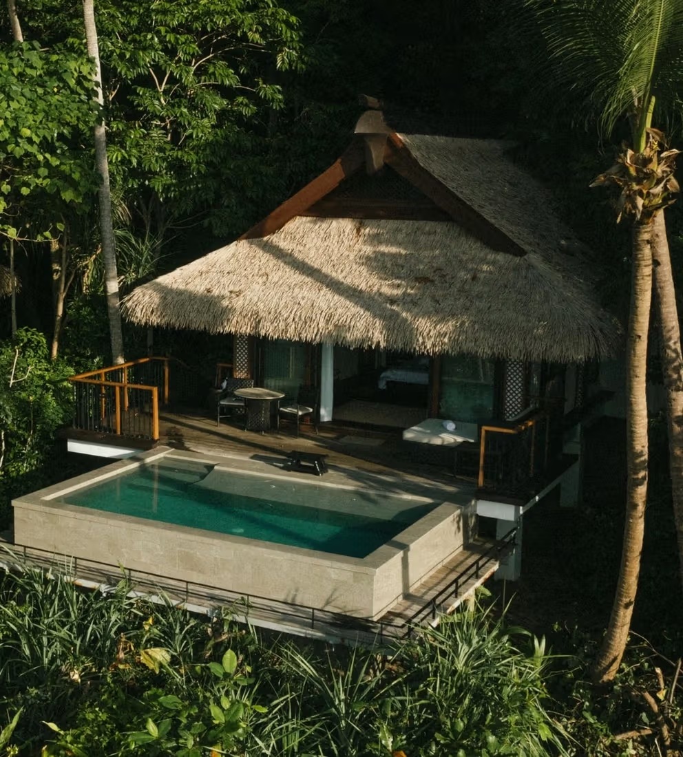 A thatched Pool Villa at Pangulasian Island Resort with a private plunge pool and shaded veranda