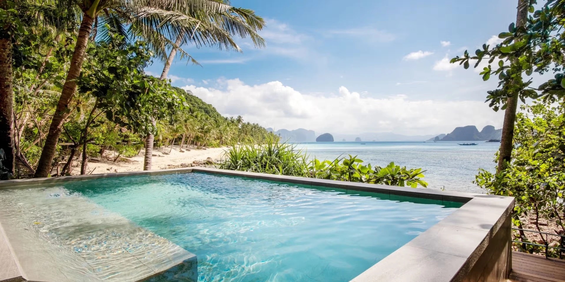 A private Pool Villa plunge pool overlooking the beach and Bacuit Bay at Pangulasian Island Resort