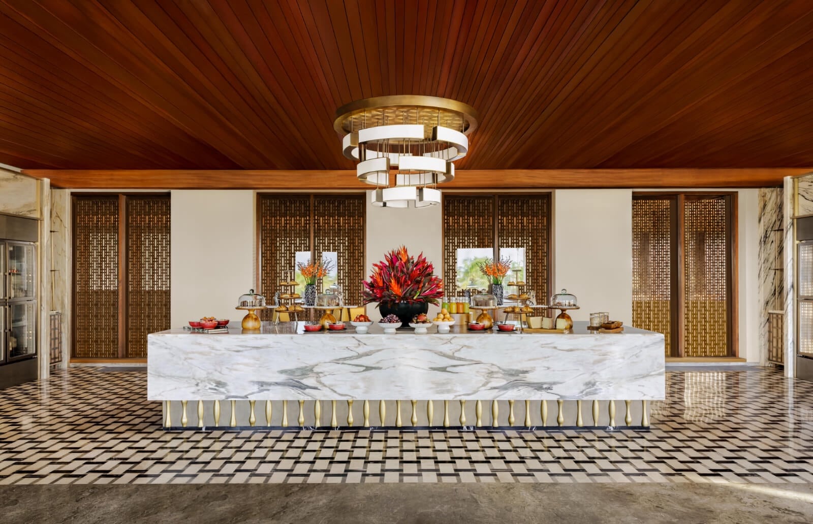 The curved bar and seating inside the Regent Club at Regent Bali Canggu.