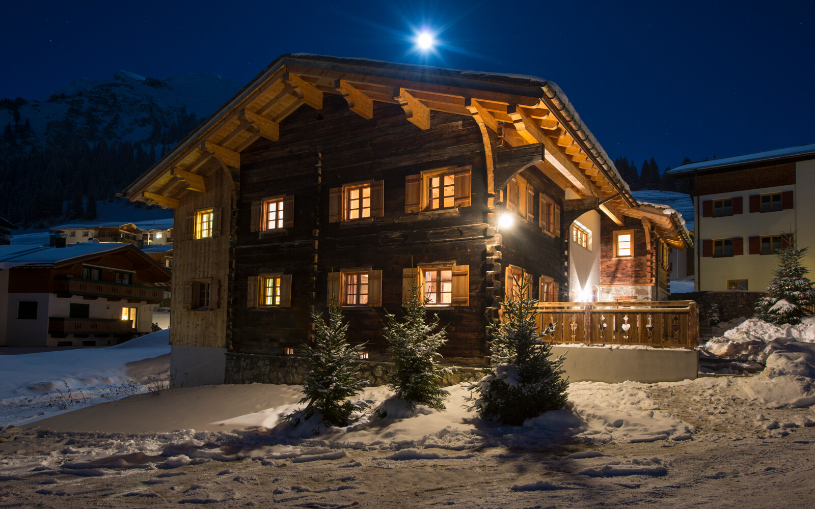 The historic timber exterior of Chalet 1597 in Lech in winter.