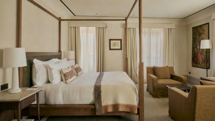 A bedroom with a four-poster bed and soft curtains at La Réserve Firenze.