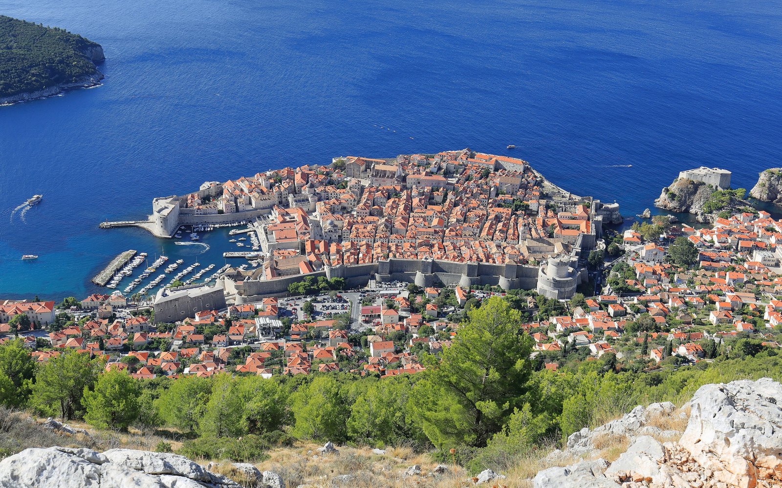 The walled old town of Dubrovnik above the Adriatic in late afternoon light