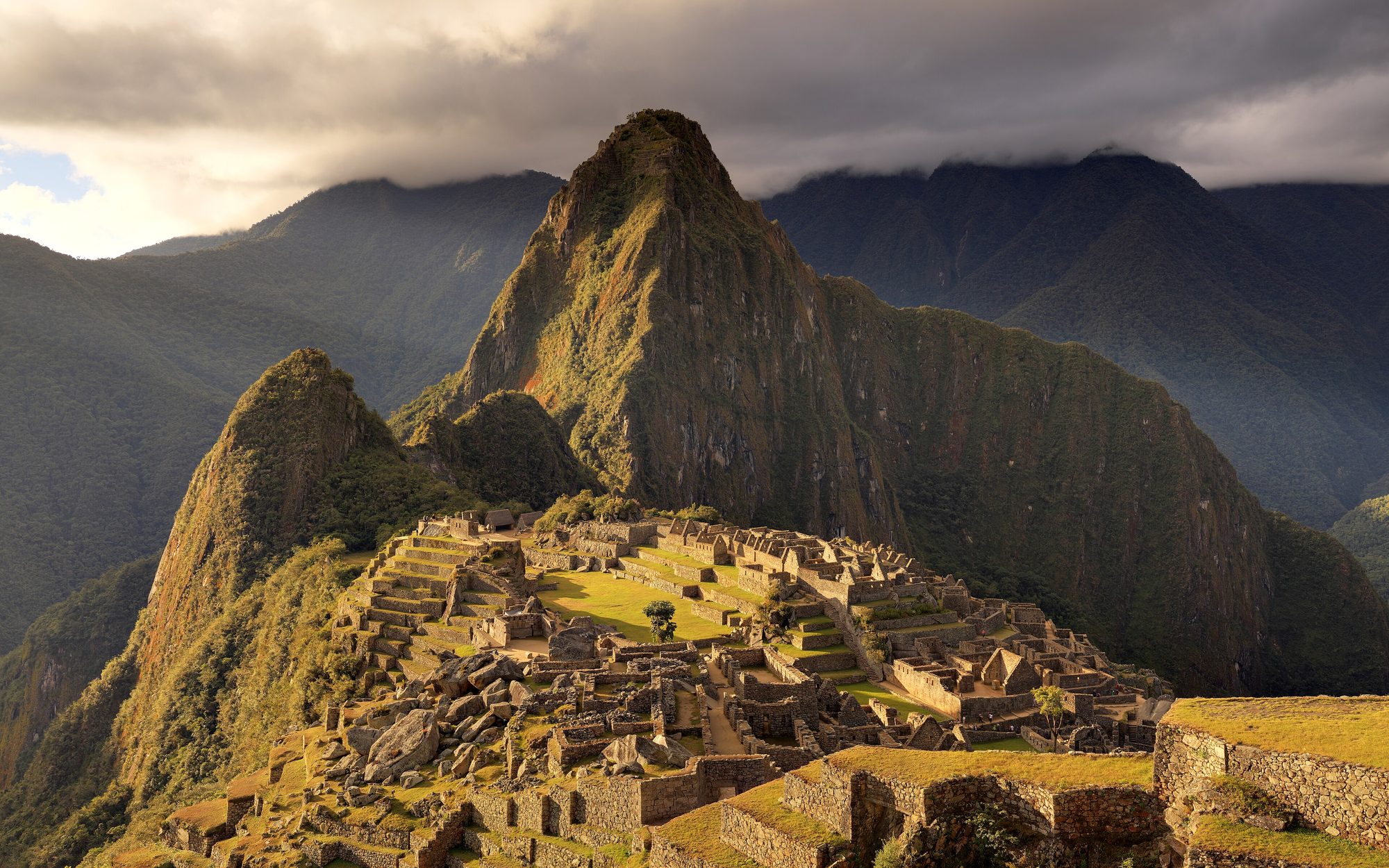 Machu Picchu in early morning mist with the peak of Huayna Picchu behind